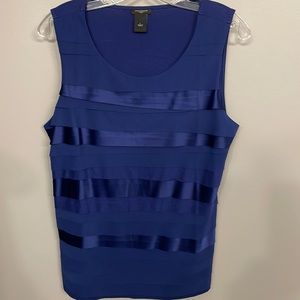 Navy tank top with layered satin type strips.